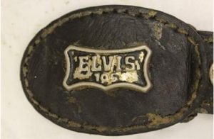 Belt buckle belonging to Gilberto Francisco Ramos Juarez. A phone number for his brother in Chicago was scribbled on the inside.