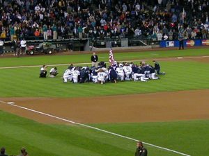 The team chaplain leads the Mariners in prayer