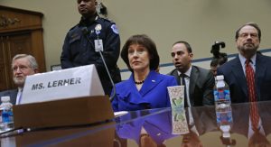 WASHINGTON, DC - MARCH 05:  Former Internal Revenue Service official Lois Lerner (C) exercises her Fifth Amendment right not to speak about the IRS targeting investigation before the House Oversight and Government Reform Committee during a hearing in the Rayburn House Office Building March 5, 2014 in Washington, DC. Chairman Darrell Issa (R-CA) adjuourned after Lerner refused to answer questions about the investigation.  (Photo by Chip Somodevilla/Getty Images)