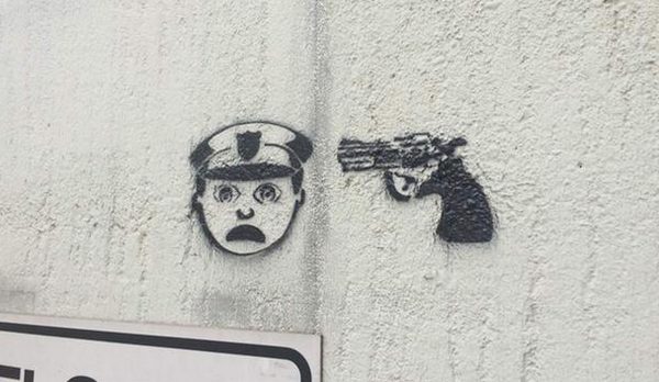 Graffiti of “Police Officer at Gunpoint” Stenciled Around Houston (PHOTO)