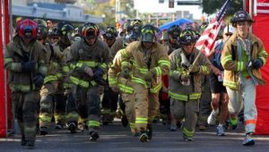 Firefighters running in the Stephen Siller Tunnel To Towers 5k. 