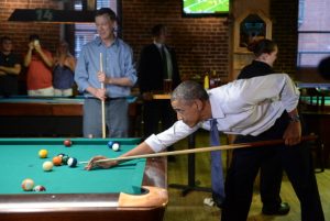 DENVER, CO - JULY 08: President Barack Obama plays pool with Colorado Governor John Hickenlooper at Wynkoop Brewery in downtown Denver after arriving in Colorado, July 08, 2014. President Obama is in Colorado to speak about the economy and raise money for Senator Mark Udall's re-election campaign. (Photo by RJ Sangosti/The Denver Post via Getty Images)