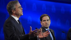 Marco Rubio, right, watches as Jeb Bush speaks during the CNBC Republican presidential debate at the University of Colorado, Wednesday, Oct. 28, 2015, in Boulder, Colo. (AP Photo/Mark J. Terrill)