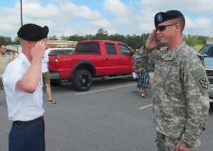 My son, right, receives a salute from my nephew, left, after my nephew's OSUT graduation.