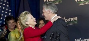 Virginia gubernatorial candidate, Democrat Terry McAuliffe, gets a hug by former Secretary of State Hillary Rodham Clinton during a campaign rally, Women for Terry, at the State Theater in Falls Church, Va. on Saturday, Oct. 19, 2013. Clinton formally endorsed her family friend's bid for Virginia governor, marking her first public campaign event since departing the State Department in February. ( AP Photo/Jose Luis Magana)