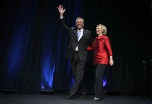 FAIRFAX, VA - JUNE 26: Democratic U.S. presidential hopeful and former U.S. Secretary of the State Hillary Clinton comes on the stage with Virginia Governor Terry McAuliffe during the Democratic Party of Virginia Jefferson-Jackson dinner June 26, 2015 at George Mason University's Patriot Center in Fairfax, Virginia. It's the first visit for Clinton since she announced her candidacy. (Photo by Alex Wong/Getty Images)