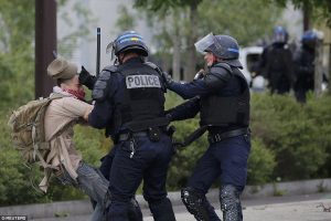 French police punching a protester