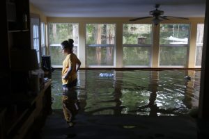 Leslie Andermann Gallagher surveys the flood damage to her home on August 17, 2016 in Sorrento, Louisiana. Last week Louisiana was overwhelmed with flood water causing at least twelve deaths and thousands of homes damaged by the flood waters. Joe Raedle, Getty Images