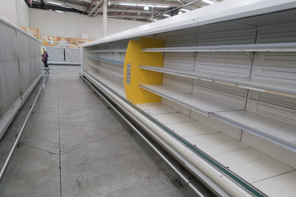  Empty refrigerator shelves at a supermarket in Caracas, on August 4 (photo: Reuters/Carlos Garcia Rawlins)