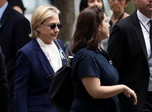 NEW YORK, NY - SEPTEMBER 11: Democratic presidental nominee former Secretary of State Hillary Clinton arrives with an unidentified woman at the September 11 Commemoration Ceremony at the National September 11 Memorial & Museum on September 11, 2016 in New York City. Hillary Clinton left a September 11 Commemoration Ceremony early after feeling overheated and went to her daughter's house to rest. (Photo by Justin Sullivan/Getty Images)