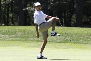 President Barack Obama reacts as he misses a shot while golfing on the first hole at Farm Neck Golf Club in Oak Bluffs, Mass., on the island of Martha's Vineyard on Sunday, Aug. 11, 2013. (AP Photo/Jacquelyn Martin)