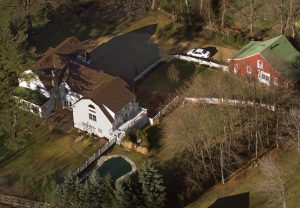 FILE - In this Jan. 5, 2000, file photo, the President Bill Clinton and Hillary Rodham Clinton's home is seen from the air in Chappaqua, N.Y. The server computer that transmitted and received Hillary Clintons emails on a private account she used exclusively for official business when she was secretary of state traced back to a residential Internet service registered at her familys five-bedroom home in Chappaqua, according to Internet records reviewed by The Associated Press. (AP Photo/Kathy Willens, File)