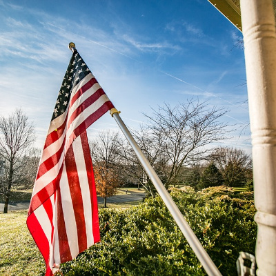 My America:  Delivery Man Fixes American Flag